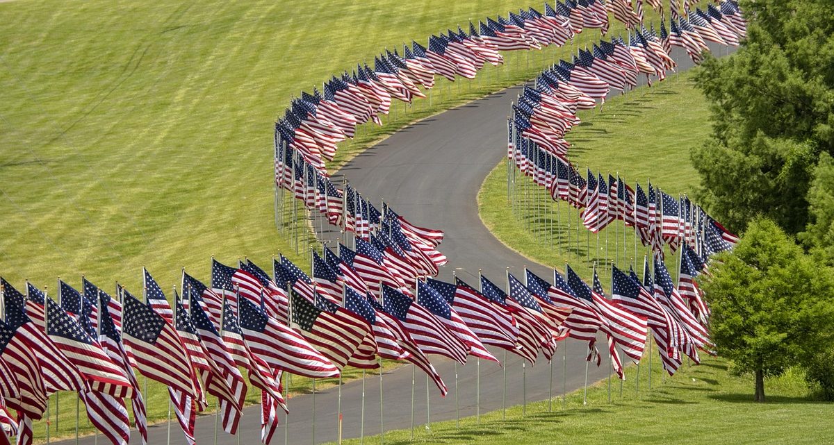 Rows of American flags representing US B1/B2 visa applications from Abu Dhabi and Dubai